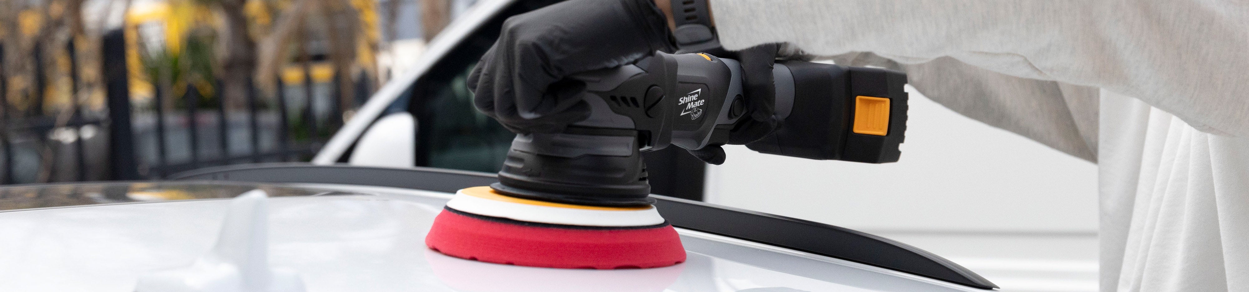 Cordless polisher on car panel